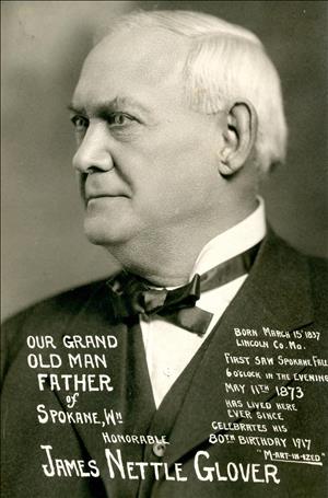 Portrait of a white man smiling and looking to his right